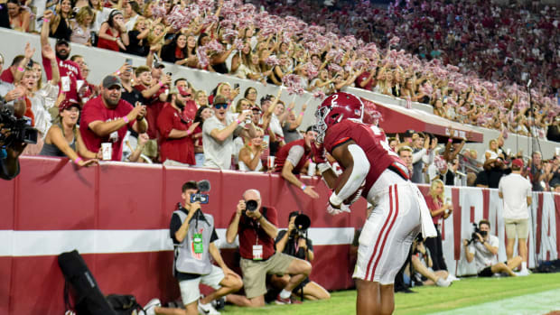 Alabama Crimson Tide running back Jase McClellan (2) celebrates with fans after scoring a touchdown against the Utah State Aggies at Bryant-Denny Stadium. Alabama won 55-0.